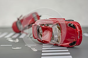 Two cars accident crash on road  insurance case, broken toys car