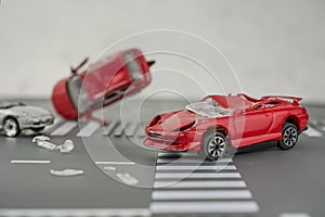 Two cars accident crash on road  insurance case, broken toys car