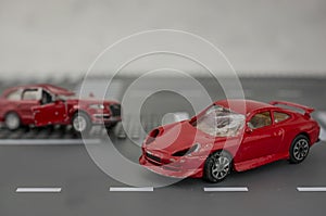 Two cars accident crash on road  insurance case, broken toys car