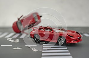 Two cars accident crash on road  insurance case, broken toys car