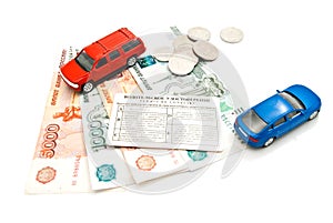 Two cars, driving license, coins and money