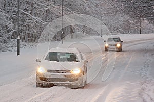 Two Cars Driving in Snow