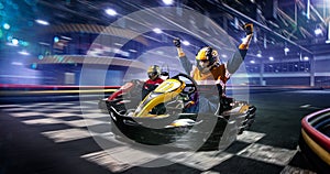 Two cart racers are racing on the grand track photo