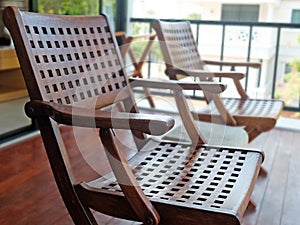 Two Carved Wooden Chairs at The Porch