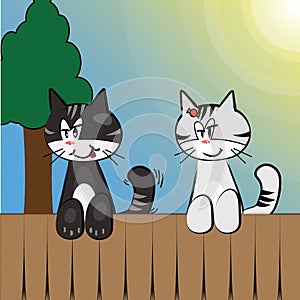 Two cats hanging on the fence