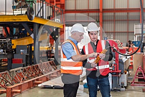 Two Caucasian engineering man, working in industry