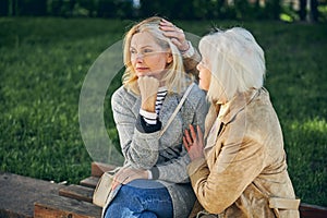 Two Caucasian women thinking about something in the part