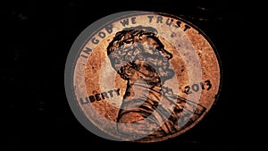 Two cents coin's is in dark room. Close up