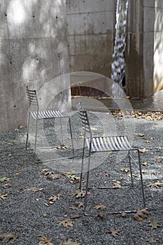 Two chairs arranged in the park background