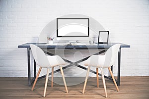 Two chairs at desk