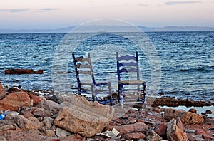 Two chairs on the empty beach