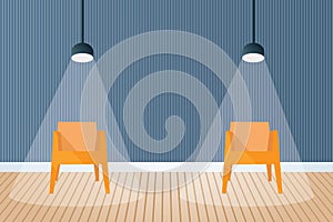 Two chairs far apart under spotlight in room