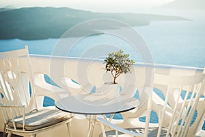 Two chairs and table on the terrace with sea view.