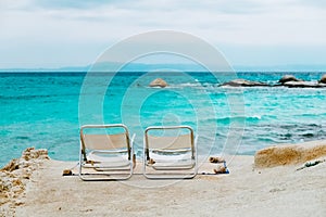 Two chairs on tropical beach