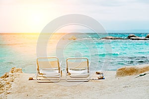 Two chairs on tropical beach