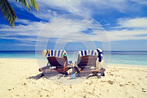 Two chairs on the tropical beach