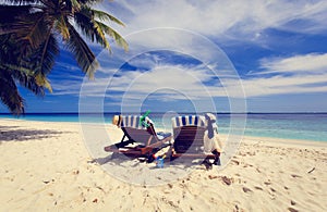 Two chairs on the tropical beach