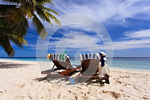 Two chairs on the tropical beach