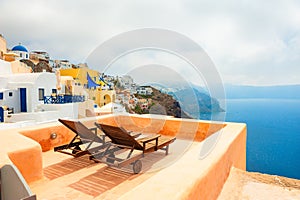 Two chaise lounges on the terrace with sea view