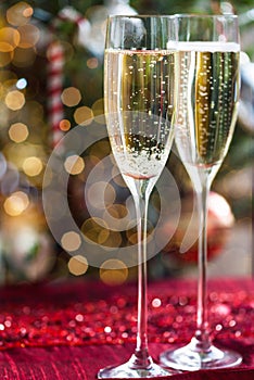 Two Champagne Flutes on Christmas Background