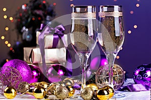 Two champagne glass on christmas bokeh background