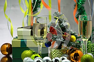 Two champagne glass on christmas bokeh background with snow