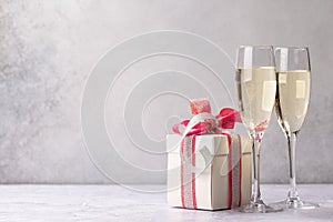 Two champagne glasses and gift box