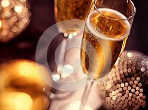 Two champagne glasses over christmas background with copy space
