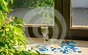 Two champagne glasses in the sunlight