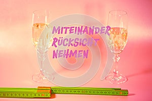 Two champagne glasses with a yardstick, symbolic of distance on New Year`s Eve, Happy New Year