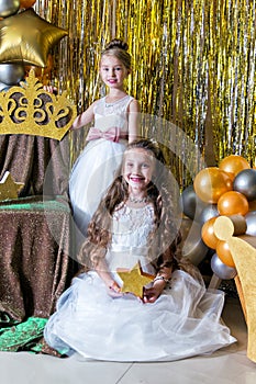 Two charming princesses at birthday celebration