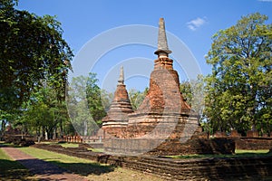 Two chedi on the ruins of the ancient Buddhist temple of Wat Phra That. Kampaeng Phet, Thailand