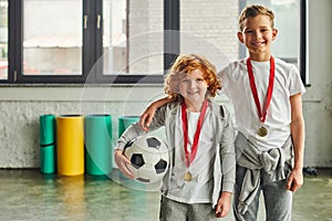 two cheerful boys in sportswear with