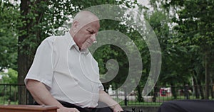 Two cheerful friends playing chess game and pushing the buttons of clock