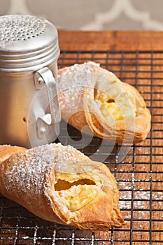 Two cheese danish on wire cooling grate