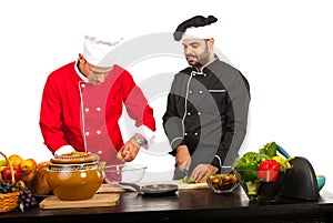 Two chefs preparing food