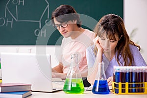 The two chemists students in classroom