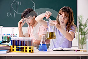 The two chemists students in classroom