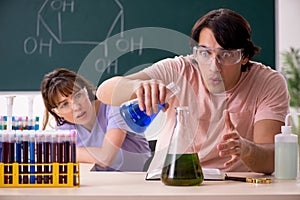 The two chemists students in classroom