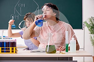 The two chemists students in classroom