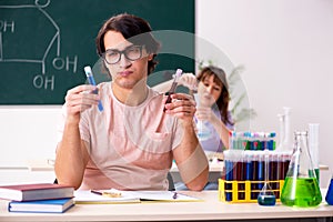 The two chemists students in classroom