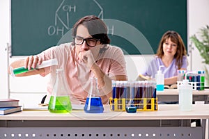 The two chemists students in classroom