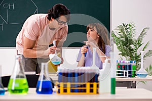 The two chemists students in classroom