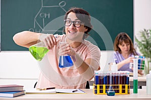 The two chemists students in classroom