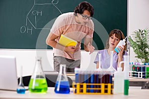 The two chemists students in classroom