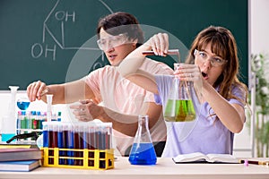 The two chemists students in classroom