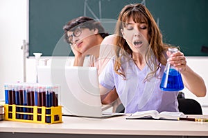 The two chemists students in classroom