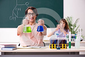 The two chemists students in classroom