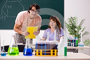 The two chemists students in classroom