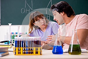 The two chemists students in classroom